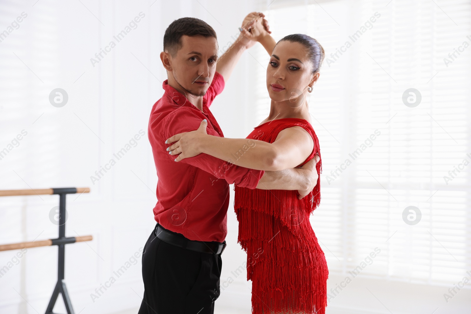 Couple of professional dancers training in studio Photo of Couple of professional dancers training in studio