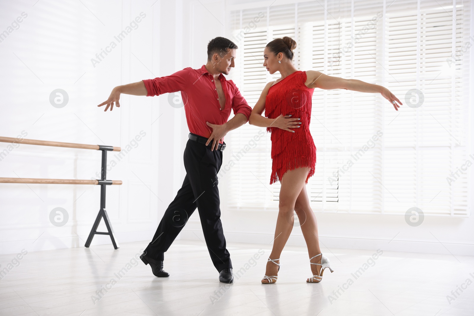 Couple of professional dancers training in studio Photo of Couple of professional dancers training in studio