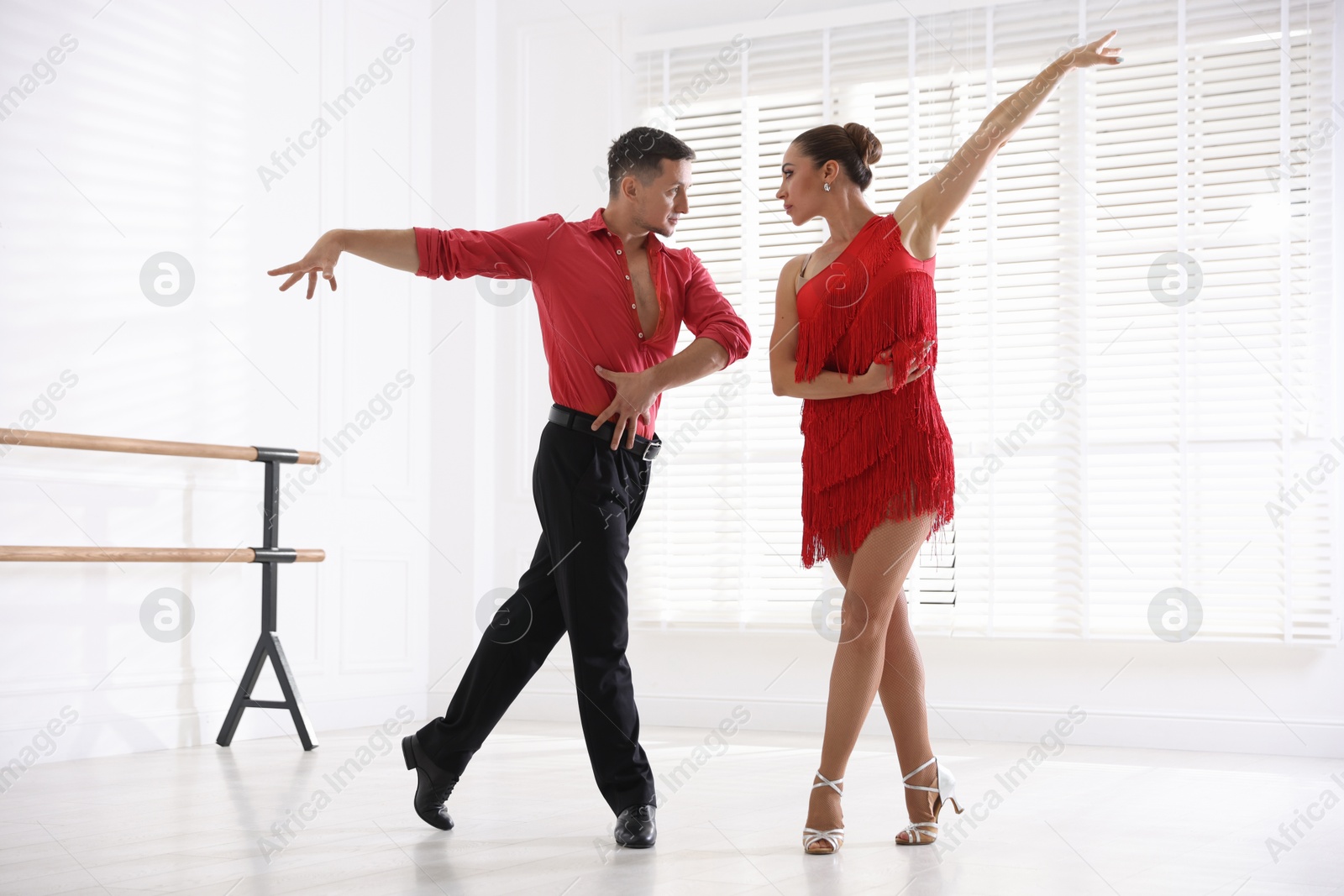 Couple of professional dancers training in studio Photo of Couple of professional dancers training in studio