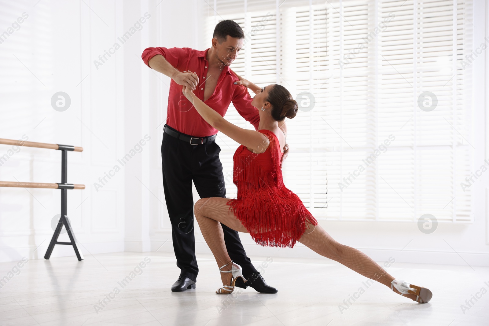Couple of professional dancers training in studio Photo of Couple of professional dancers training in studio