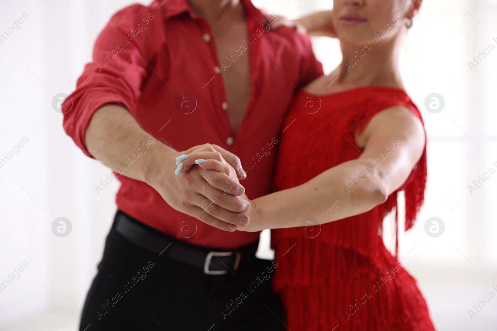 Couple of professional dancers training in studio, closeup Photo of Couple of professional dancers training in studio, closeup
