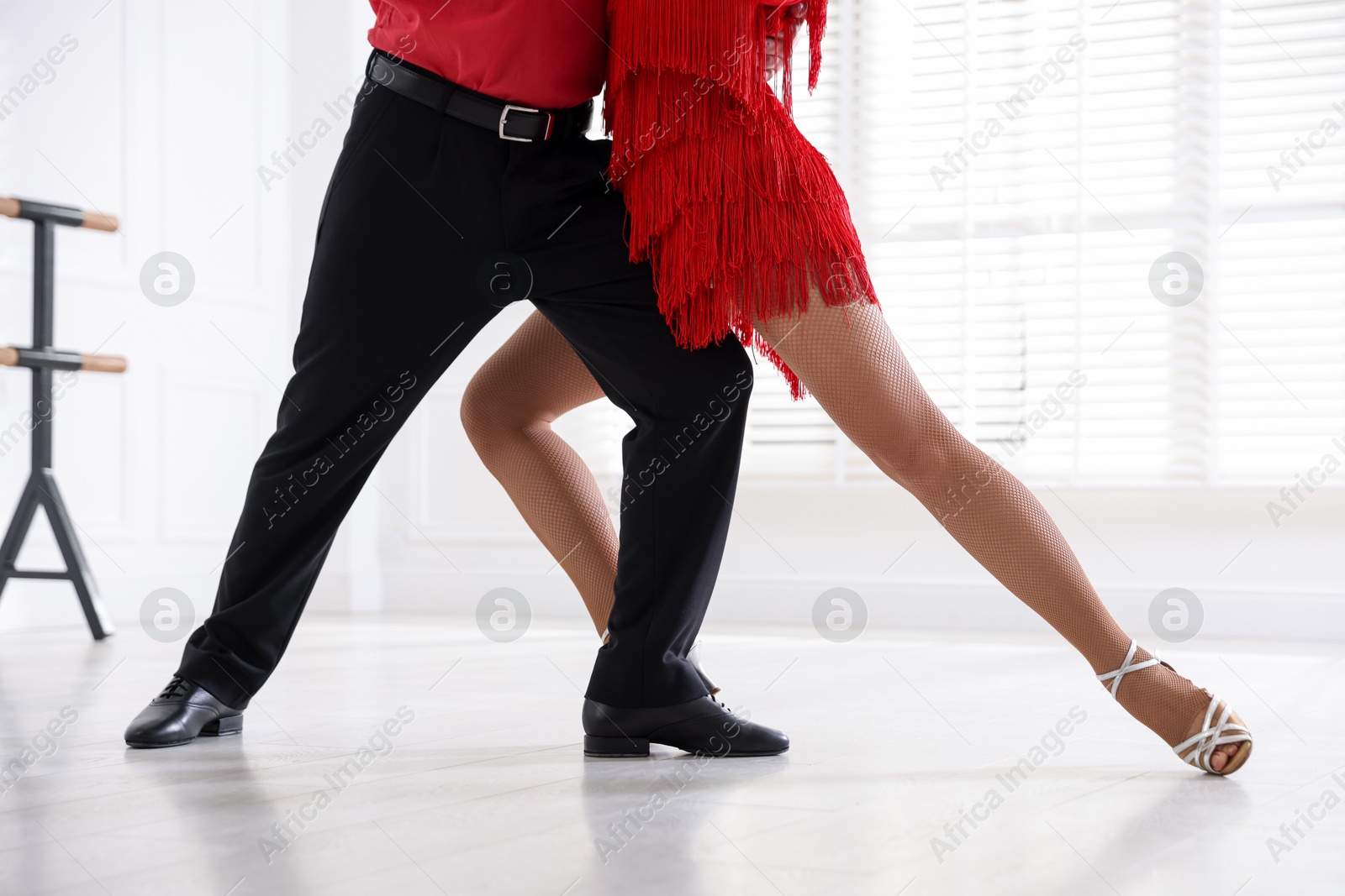 Couple of professional dancers training in studio, closeup Photo of Couple of professional dancers training in studio, closeup