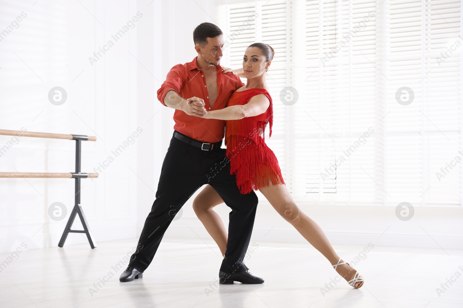 Couple of professional dancers training in studio Photo of Couple of professional dancers training in studio