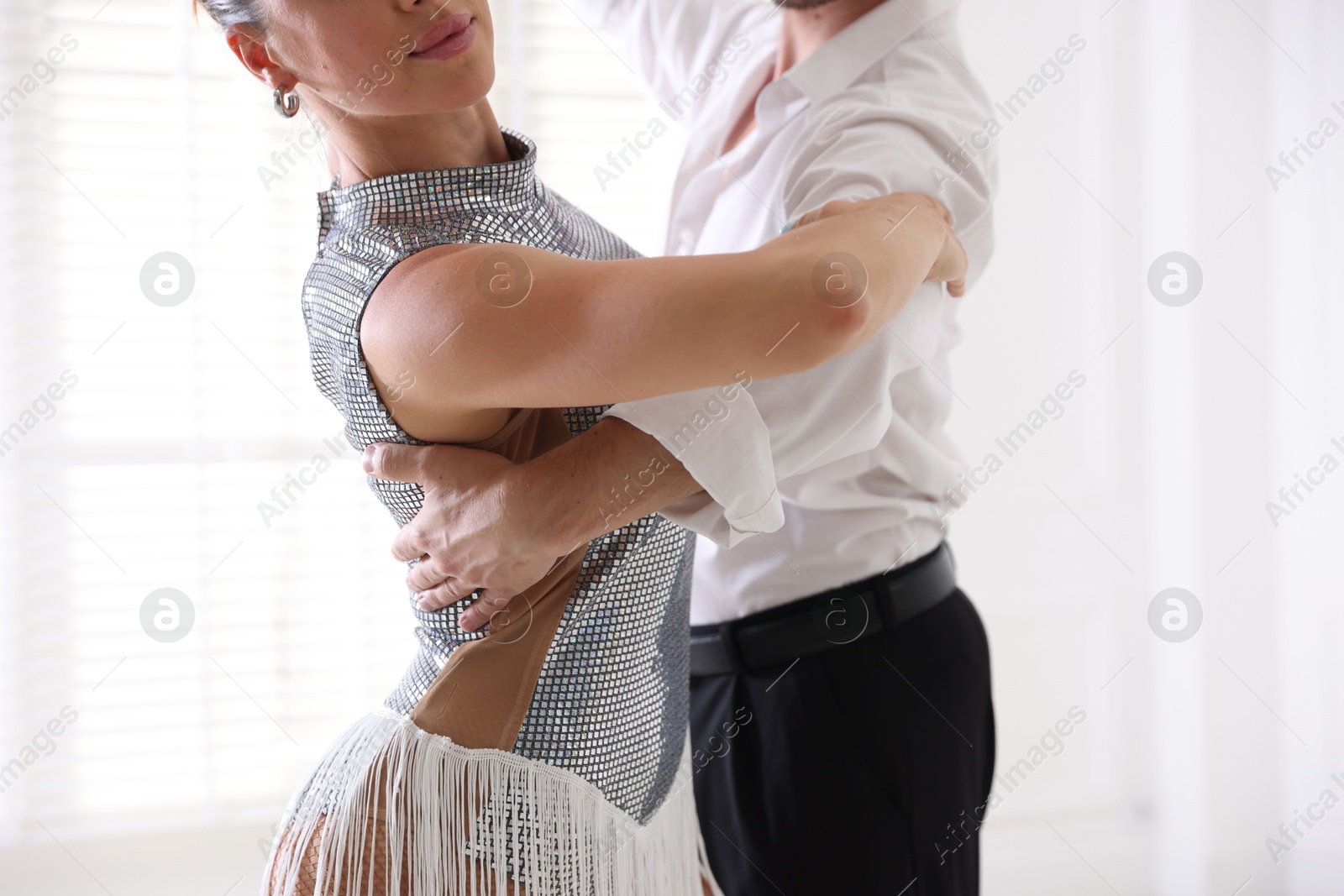 Couple of professional dancers training in studio, closeup Photo of Couple of professional dancers training in studio, closeup