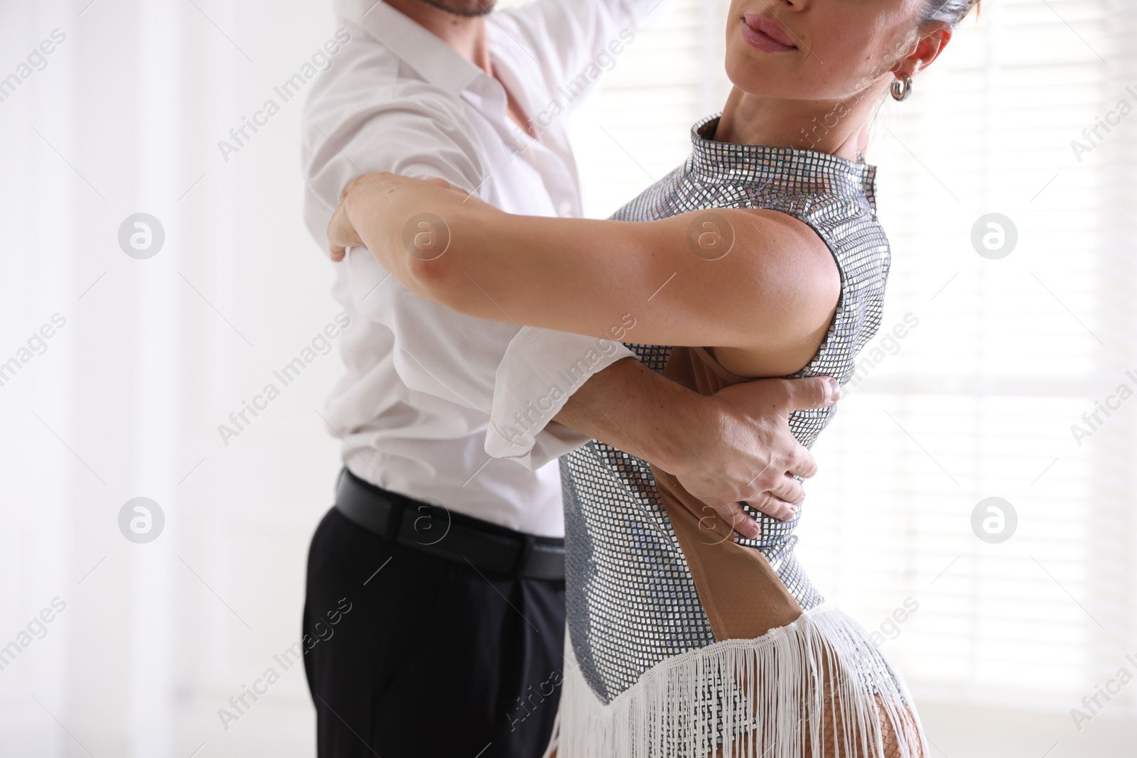 Couple of professional dancers training in studio, closeup Photo of Couple of professional dancers training in studio, closeup