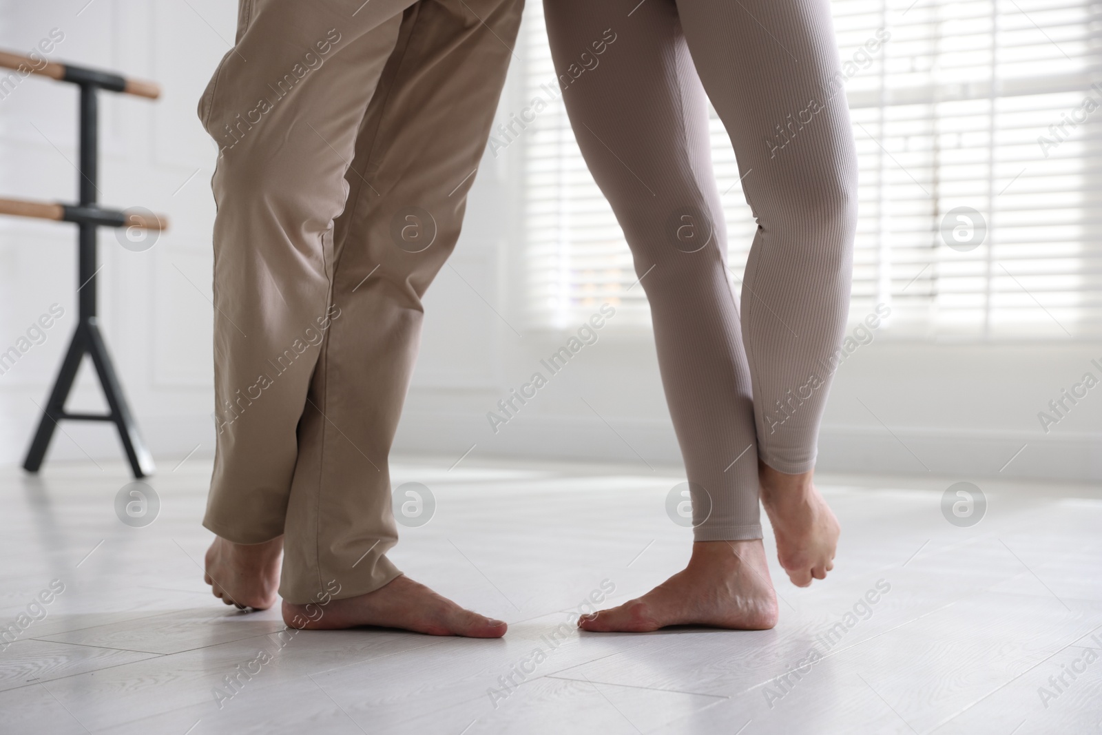 Couple of professional dancers training in studio, closeup Photo of Couple of professional dancers training in studio, closeup