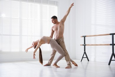 Photo of Couple of professional dancers training in studio