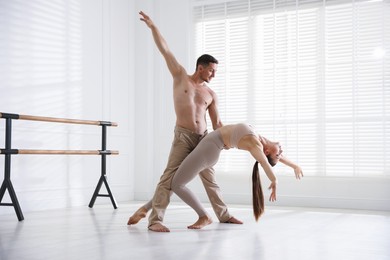 Photo of Couple of professional dancers training in studio
