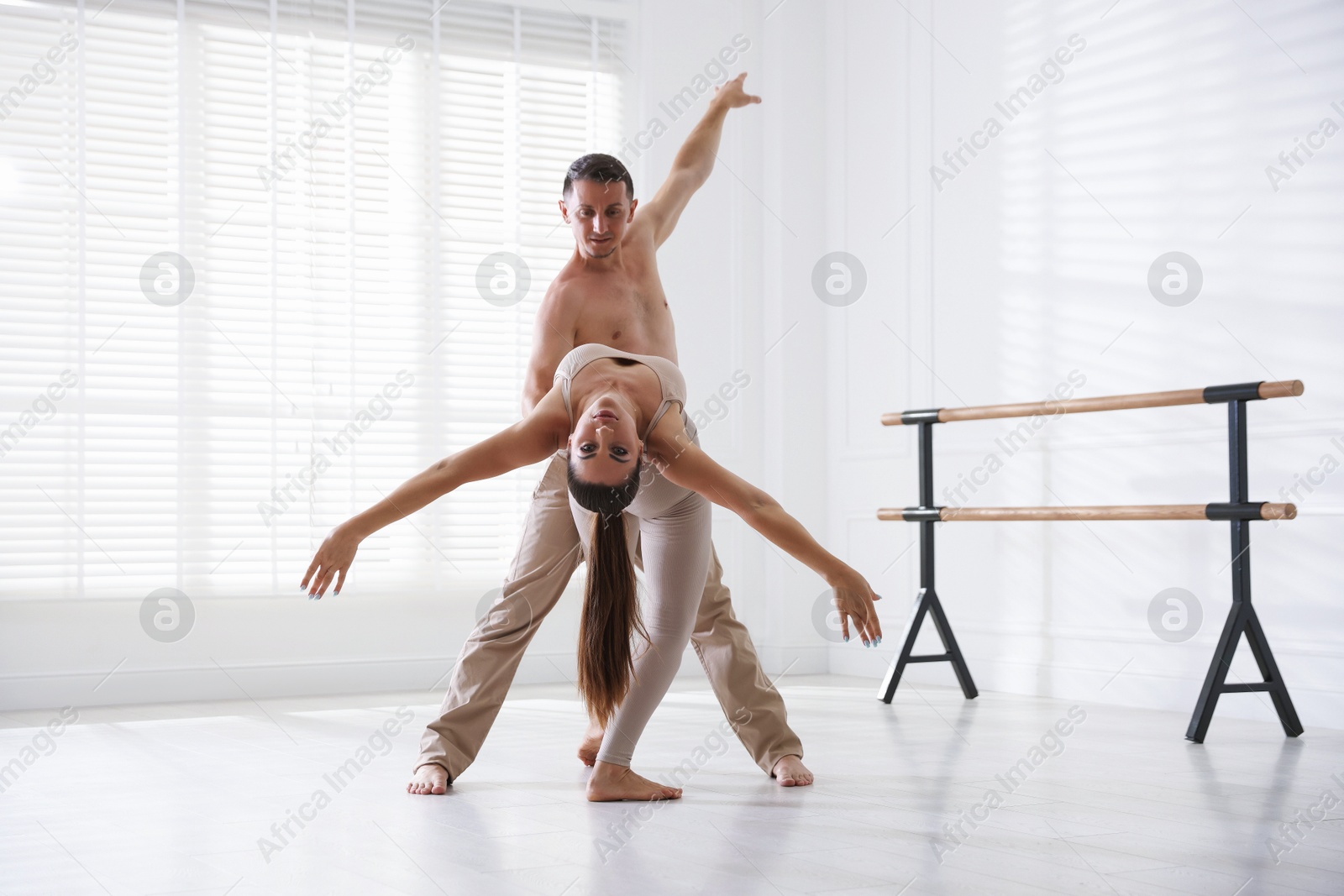 Couple of professional dancers training in studio Photo of Couple of professional dancers training in studio