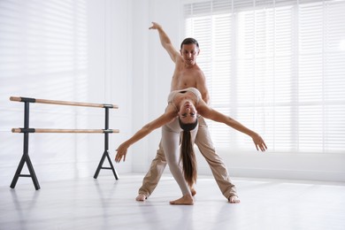 Photo of Couple of professional dancers training in studio