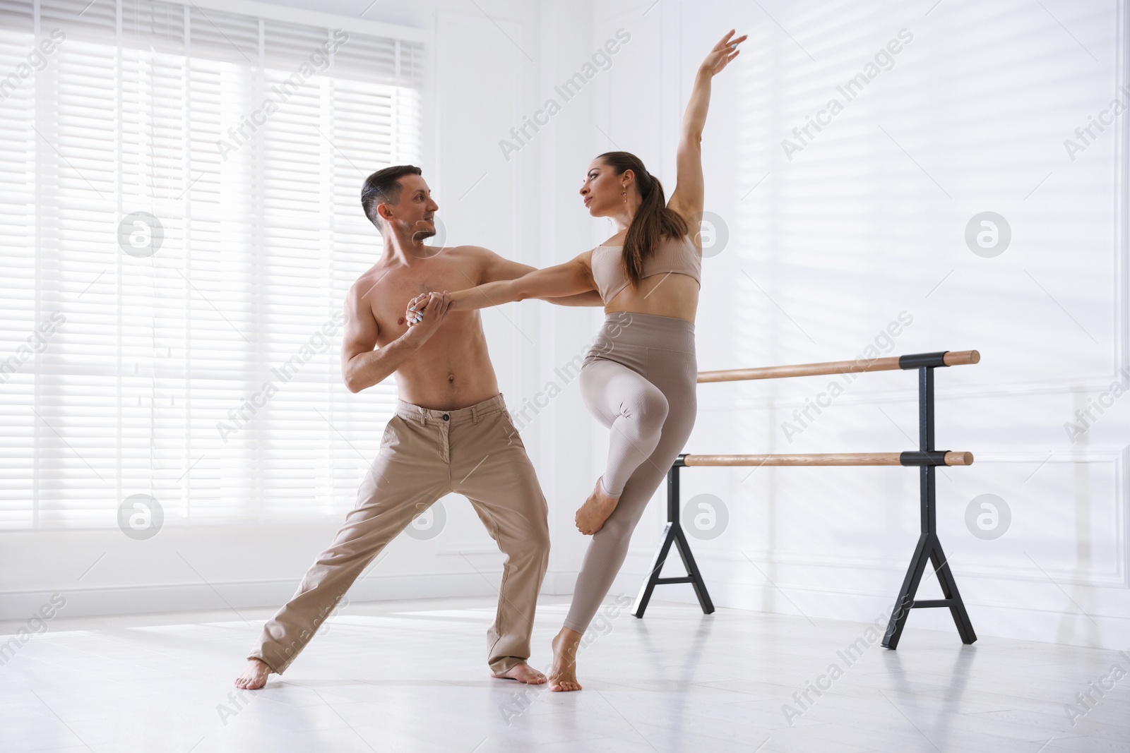 Couple of professional dancers training in studio Photo of Couple of professional dancers training in studio
