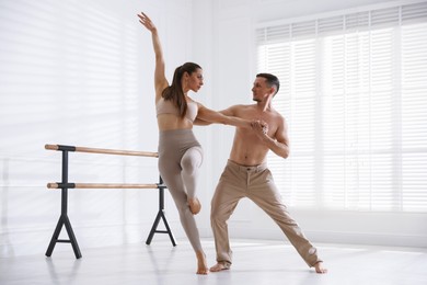 Photo of Couple of professional dancers training in studio