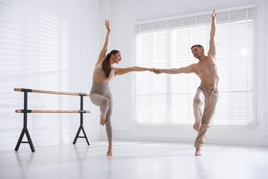 Photo of Couple of professional dancers training in studio