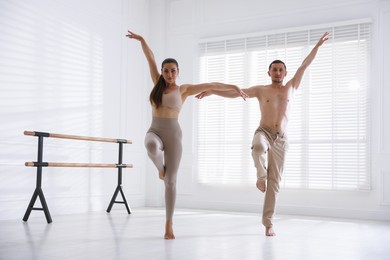 Photo of Couple of professional dancers training in studio