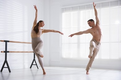 Photo of Couple of professional dancers training in studio