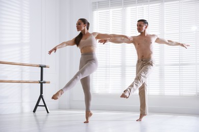Photo of Couple of professional dancers training in studio