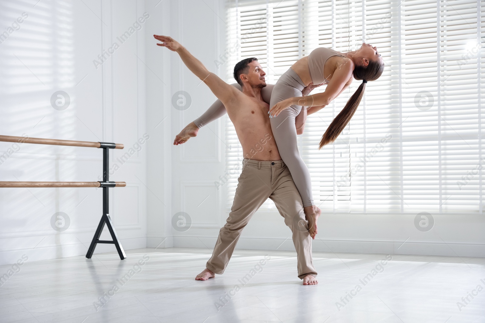 Couple of professional dancers training in studio Photo of Couple of professional dancers training in studio