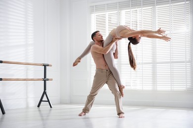 Photo of Couple of professional dancers training in studio