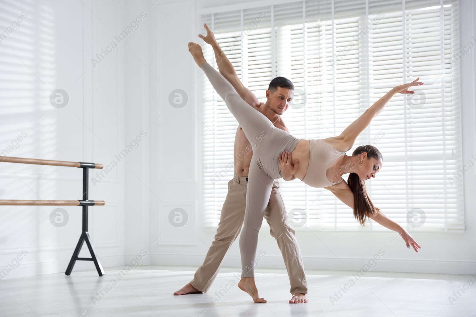 Couple of professional dancers training in studio Photo of Couple of professional dancers training in studio