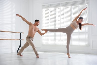 Photo of Couple of professional dancers training in studio
