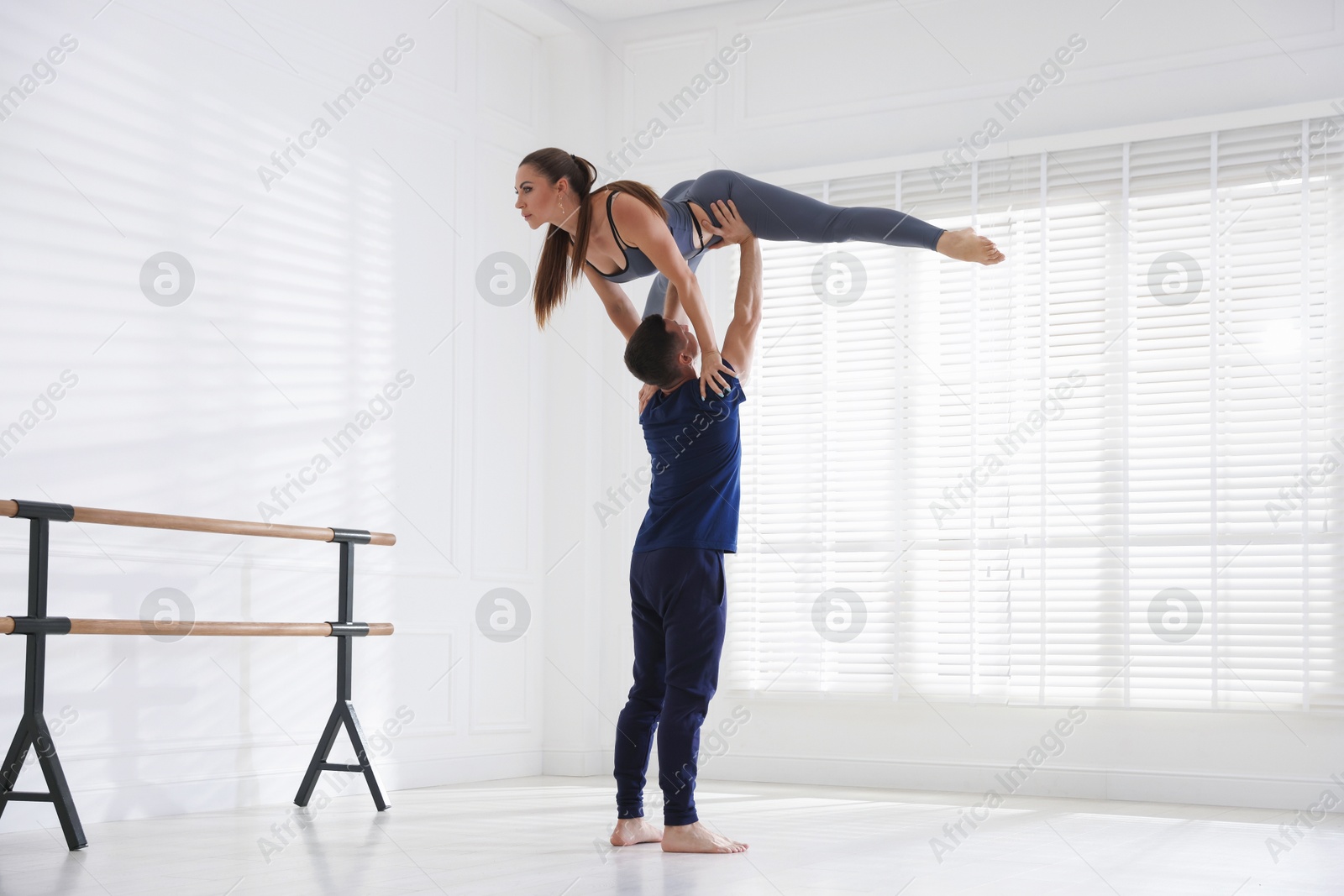 Couple of professional dancers training in studio Photo of Couple of professional dancers training in studio