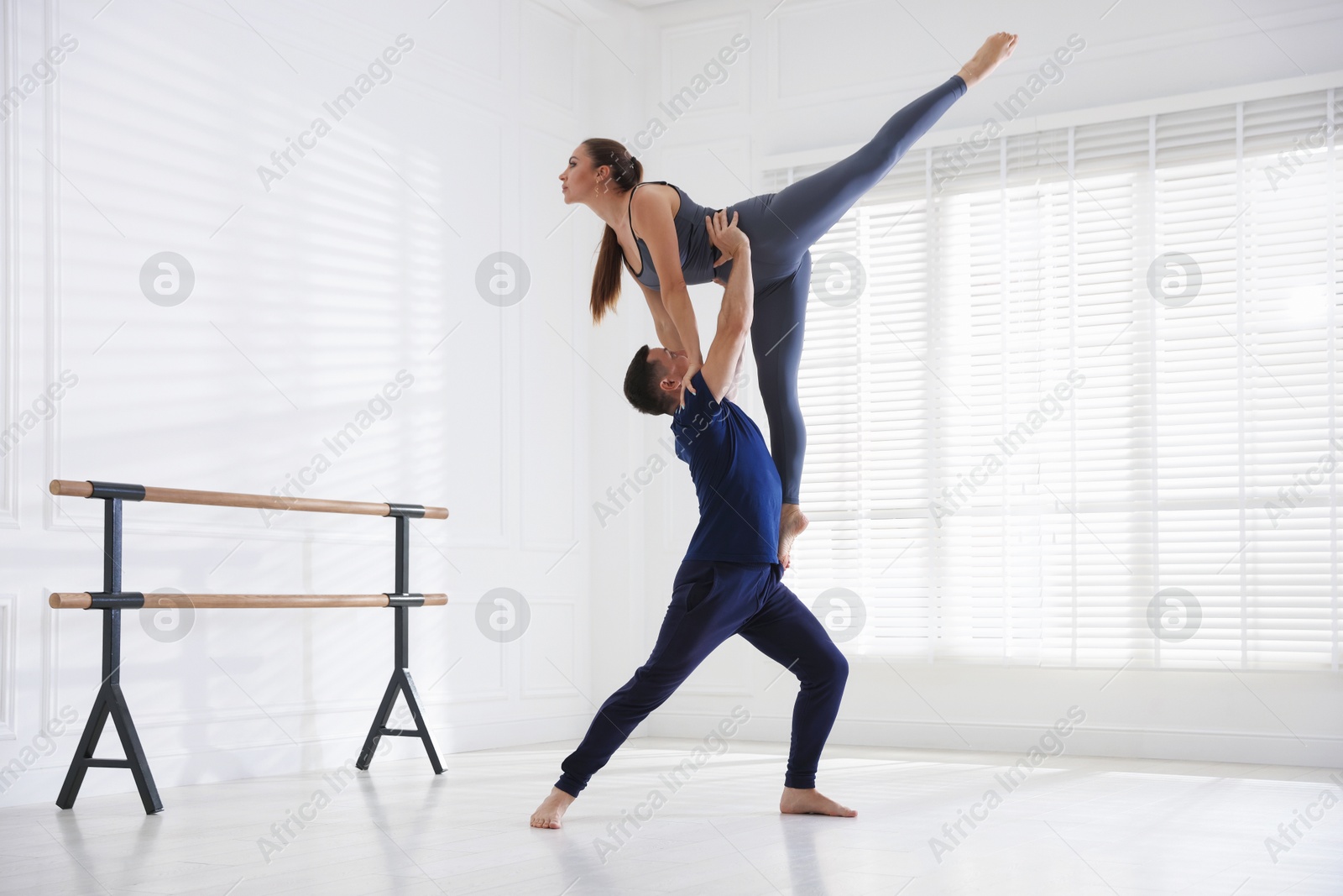 Couple of professional dancers training in studio Photo of Couple of professional dancers training in studio