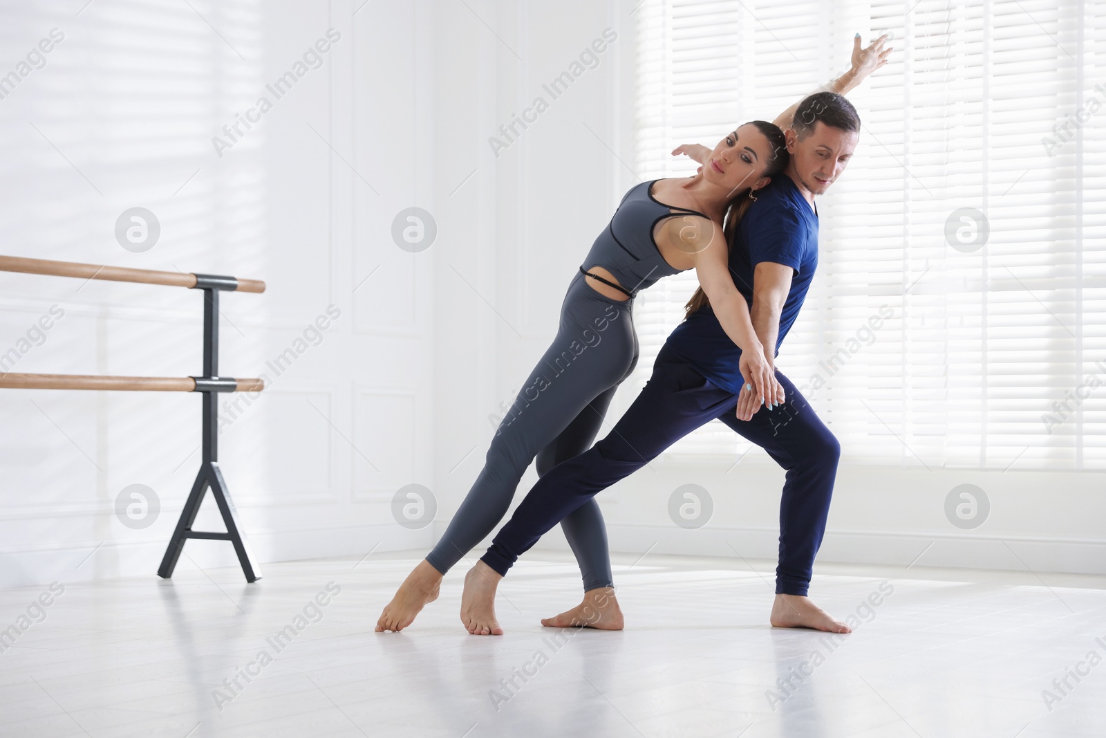 Couple of professional dancers training in studio Photo of Couple of professional dancers training in studio