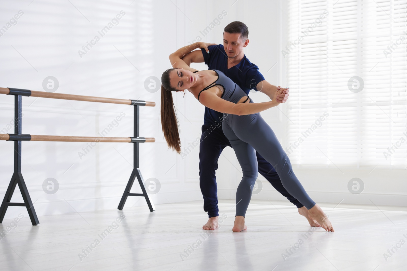Couple of professional dancers training in studio Photo of Couple of professional dancers training in studio