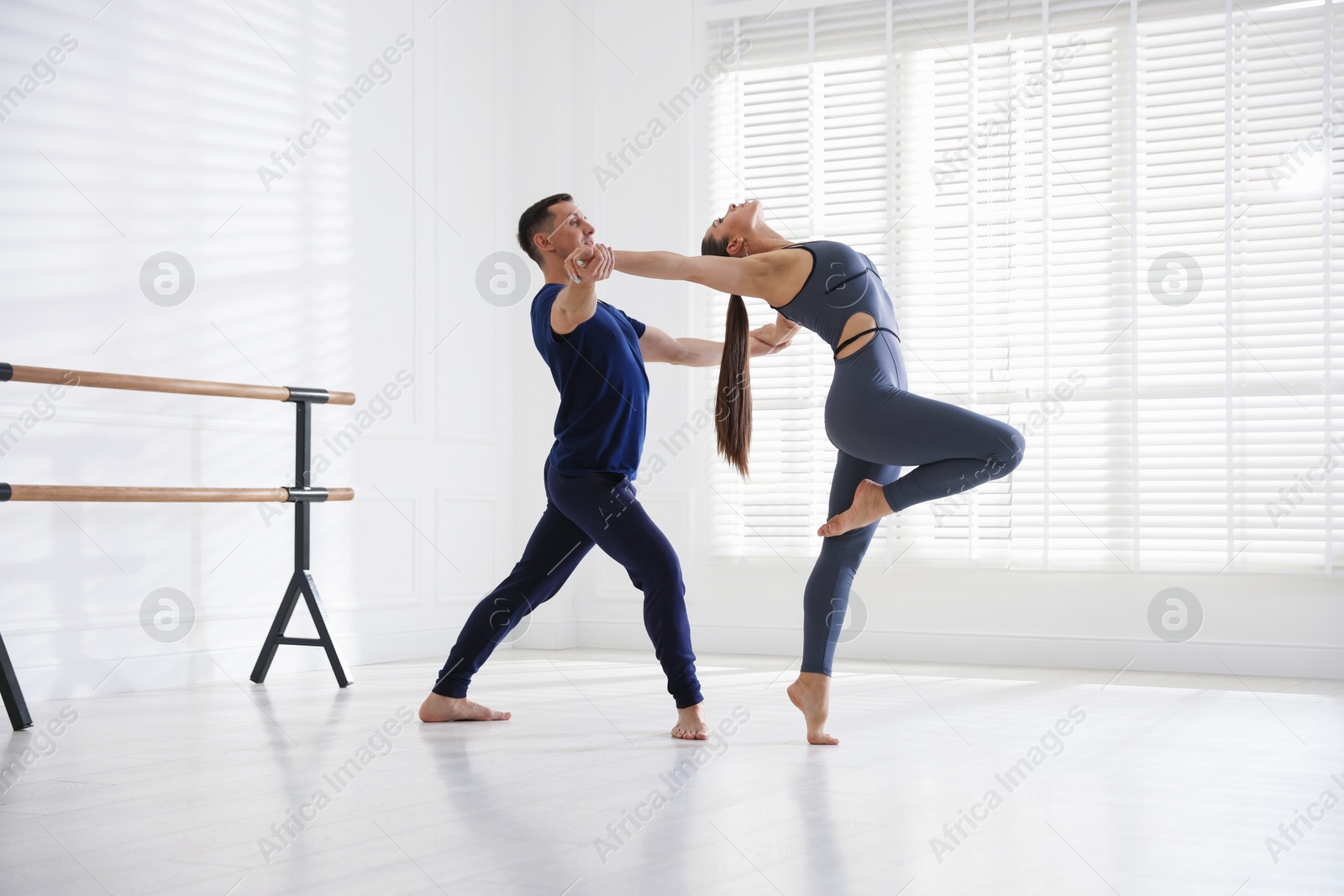 Couple of professional dancers training in studio Photo of Couple of professional dancers training in studio