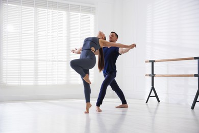 Photo of Couple of professional dancers training in studio