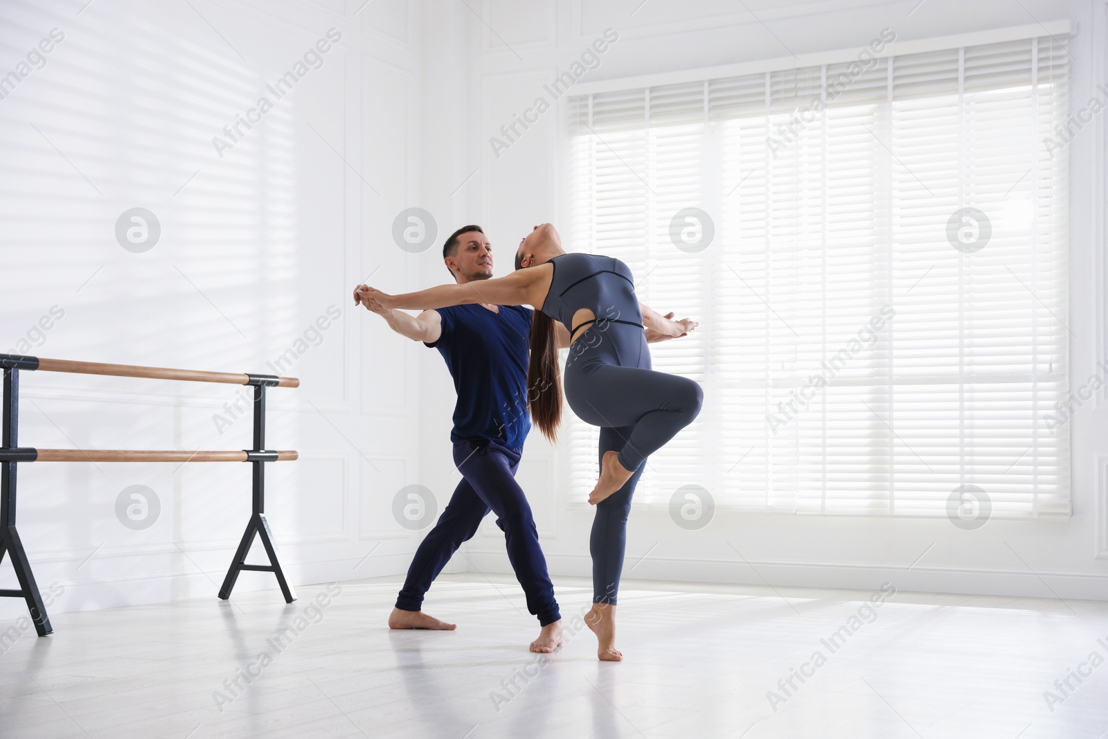 Couple of professional dancers training in studio Photo of Couple of professional dancers training in studio