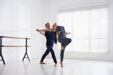 Photo of Couple of professional dancers training in studio
