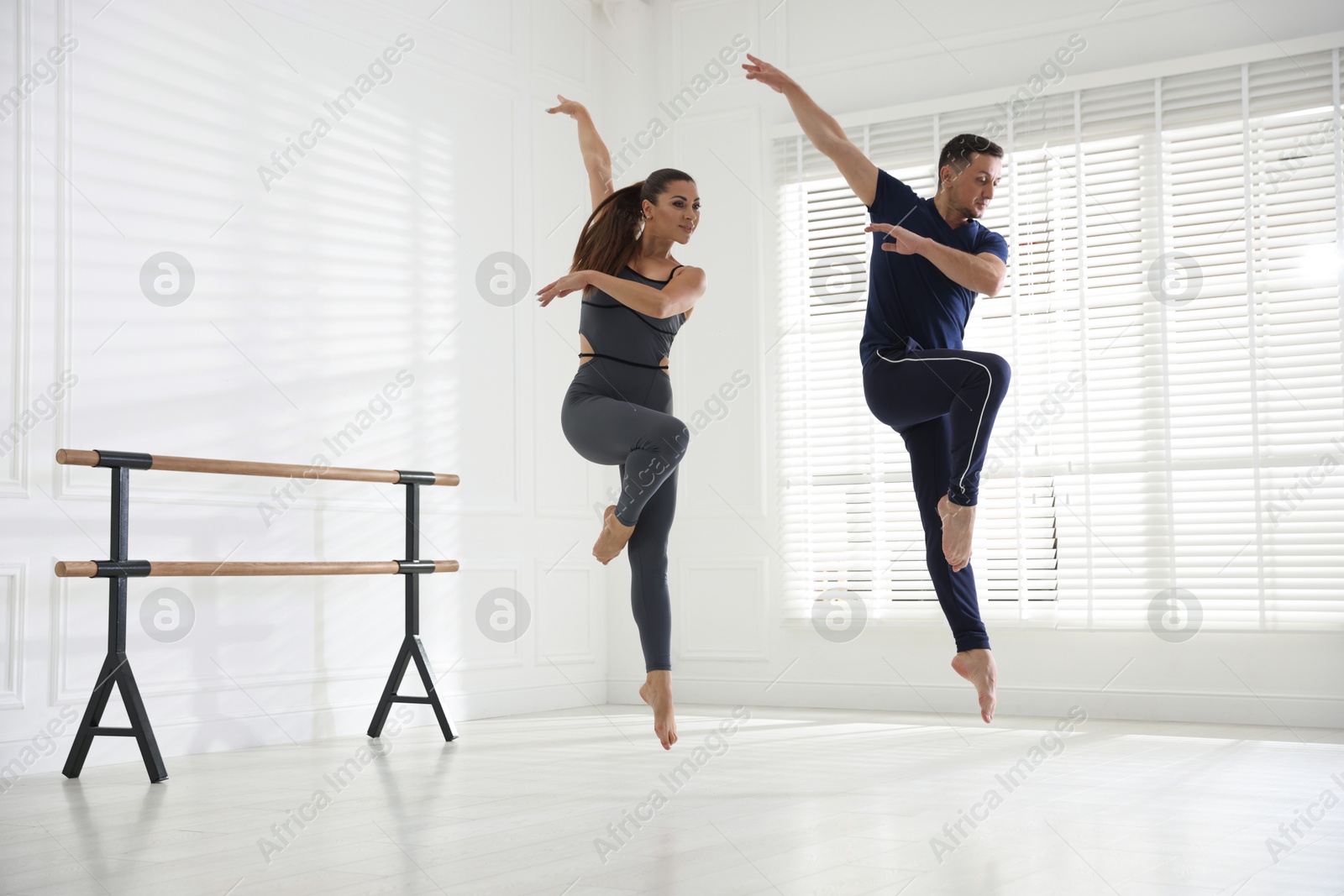Couple of professional dancers training in studio Photo of Couple of professional dancers training in studio
