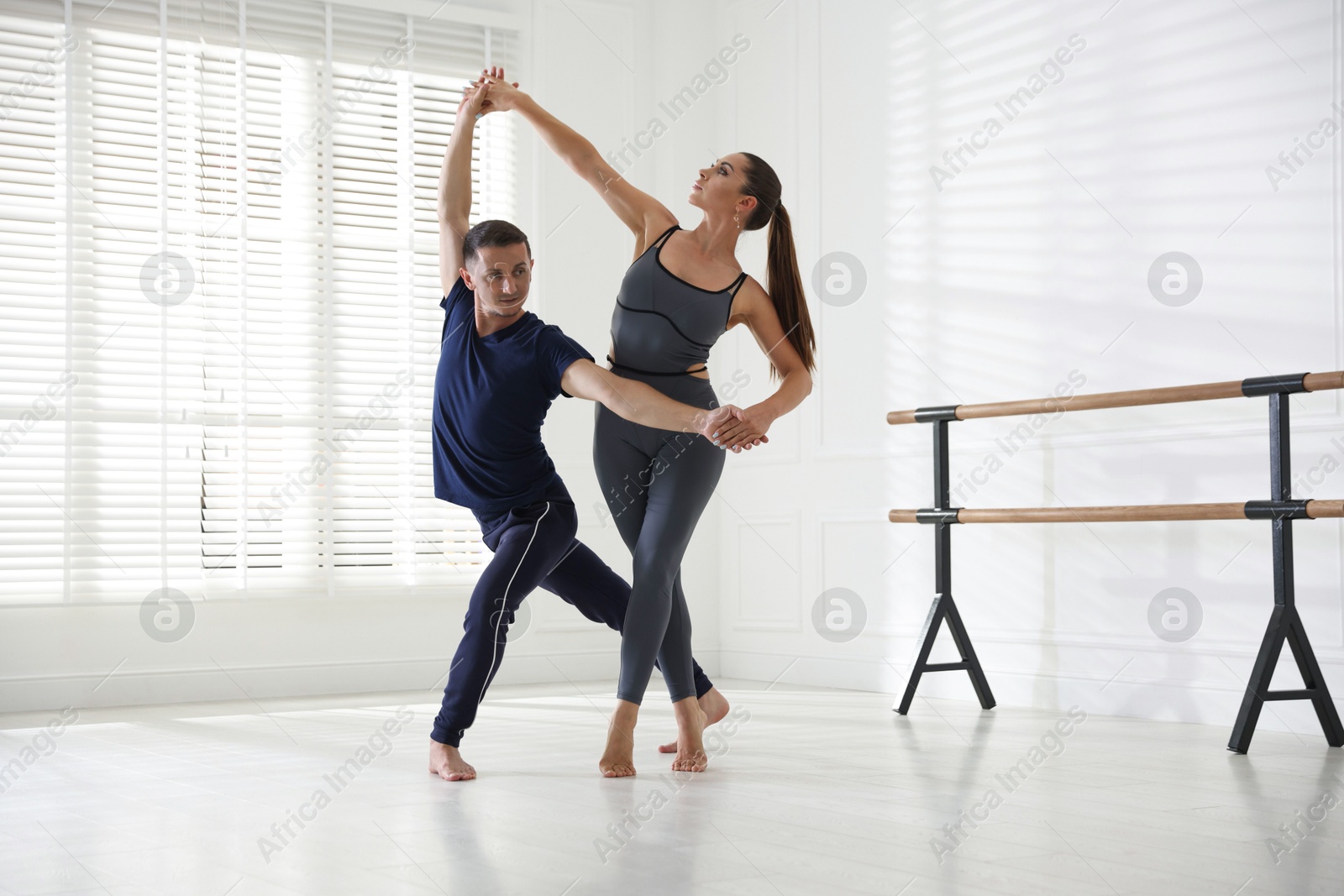 Couple of professional dancers training in studio Photo of Couple of professional dancers training in studio