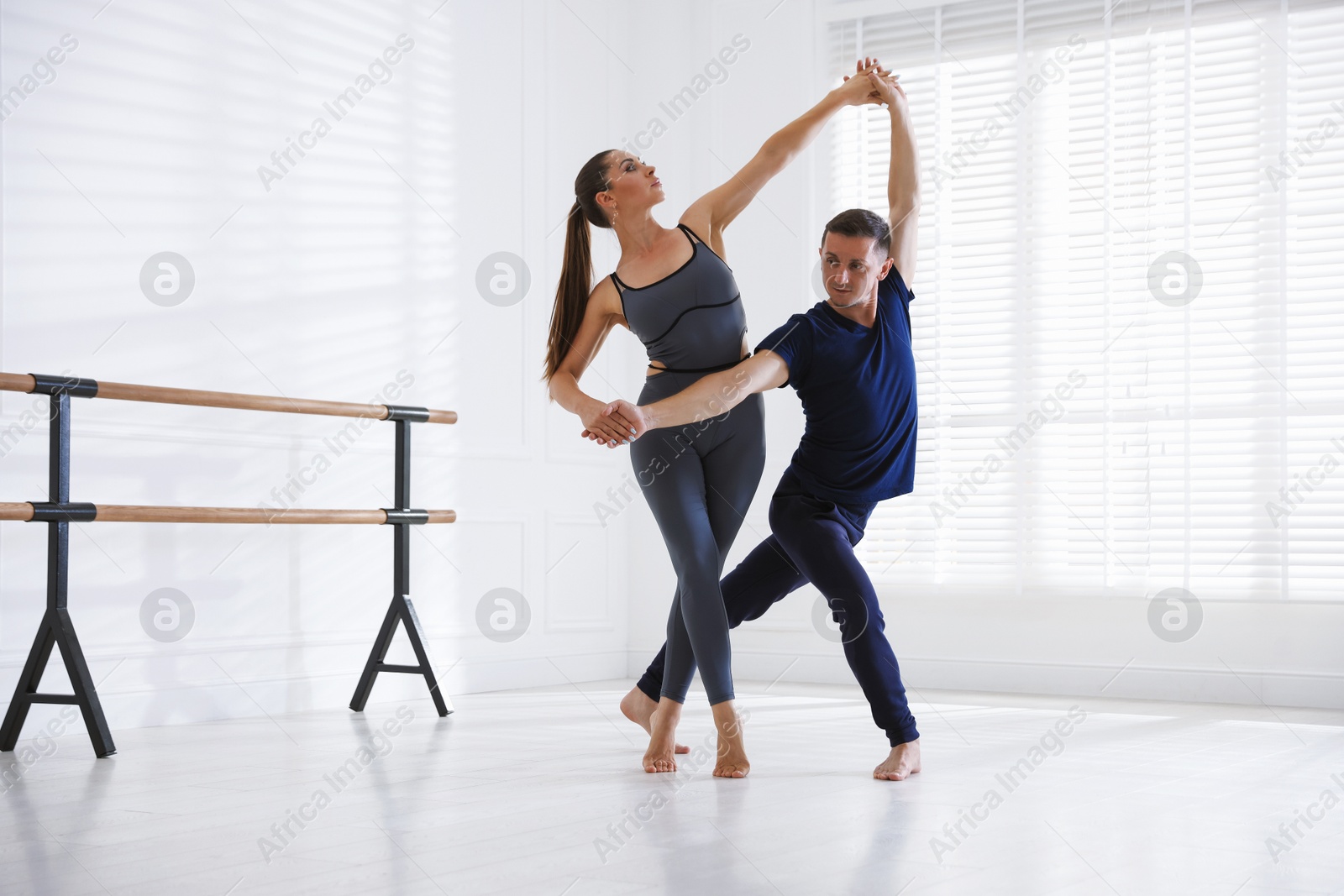 Couple of professional dancers training in studio Photo of Couple of professional dancers training in studio