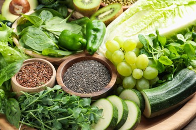 Photo of Superfood. Different healthy products on wooden table, closeup