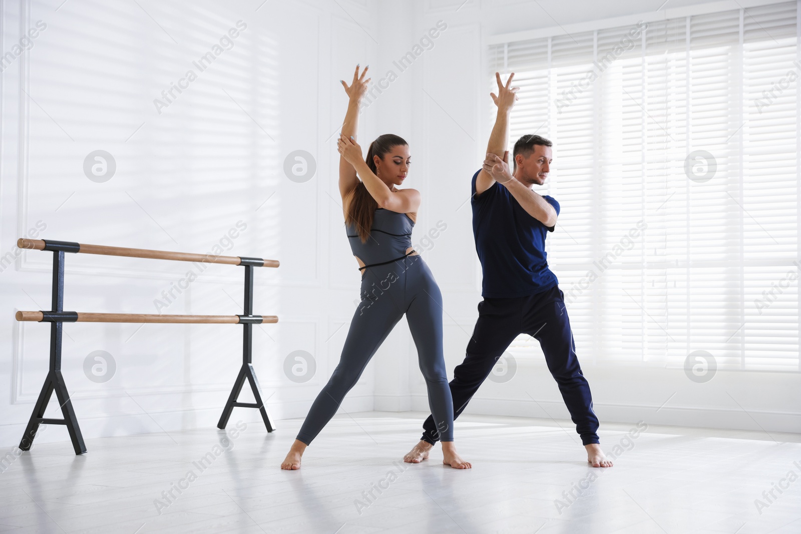 Couple of professional dancers training in studio Photo of Couple of professional dancers training in studio