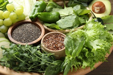 Photo of Superfood. Different healthy products on wooden table, closeup