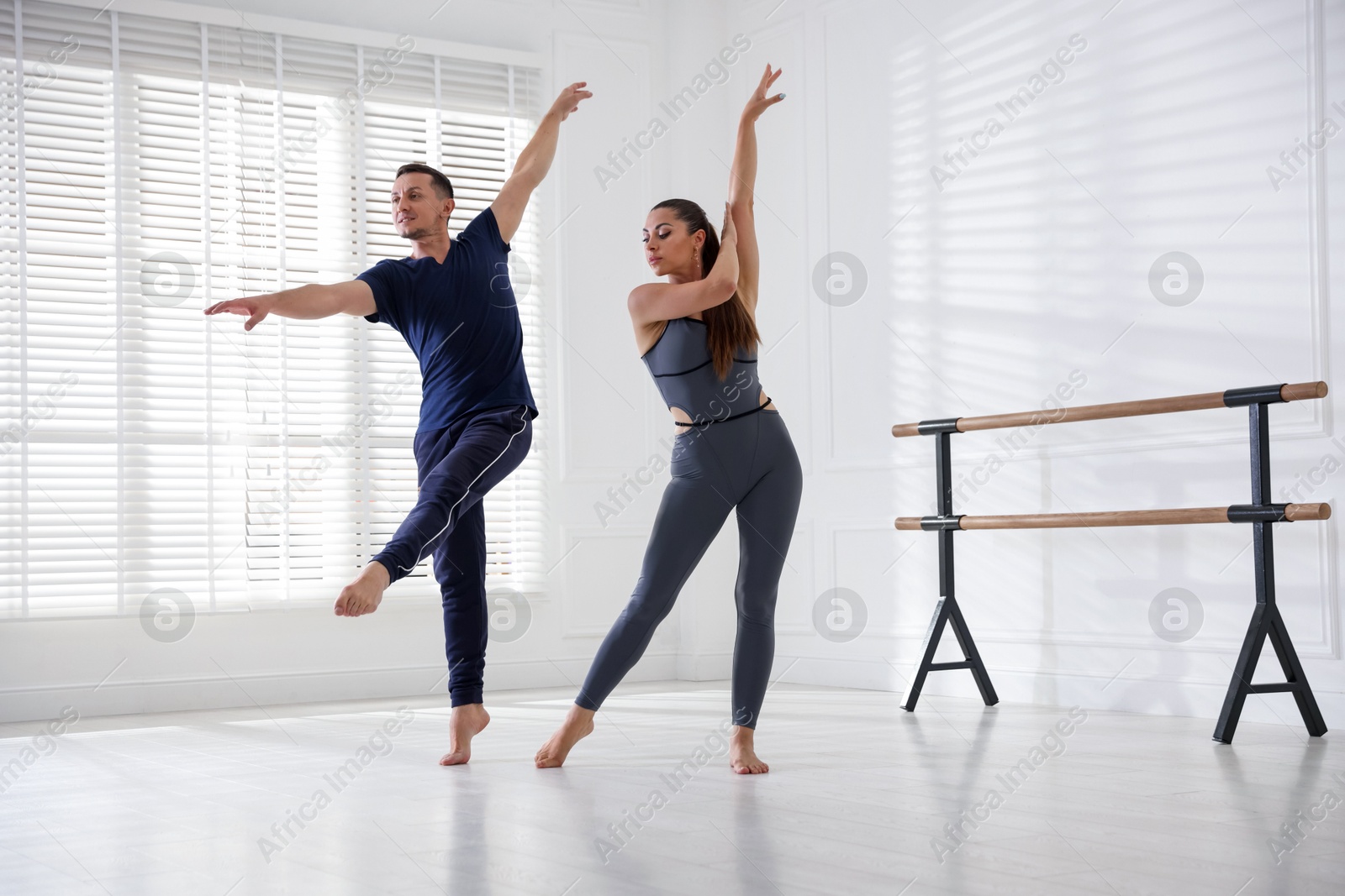 Couple of professional dancers training in studio Photo of Couple of professional dancers training in studio