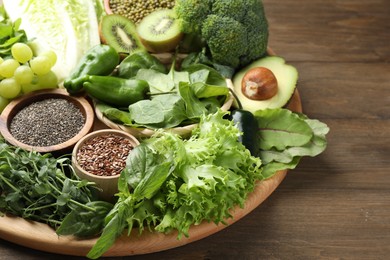 Photo of Superfood. Different healthy products on wooden table, closeup