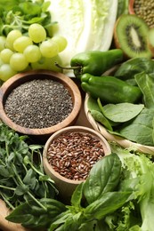 Photo of Superfood. Different healthy products on wooden table, closeup