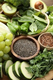Photo of Superfood. Different healthy products on wooden table, closeup