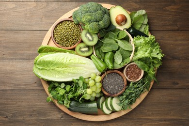 Photo of Superfood. Different healthy products on wooden table, top view