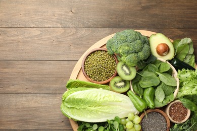 Photo of Superfood. Different healthy products on wooden table, top view. Space for text