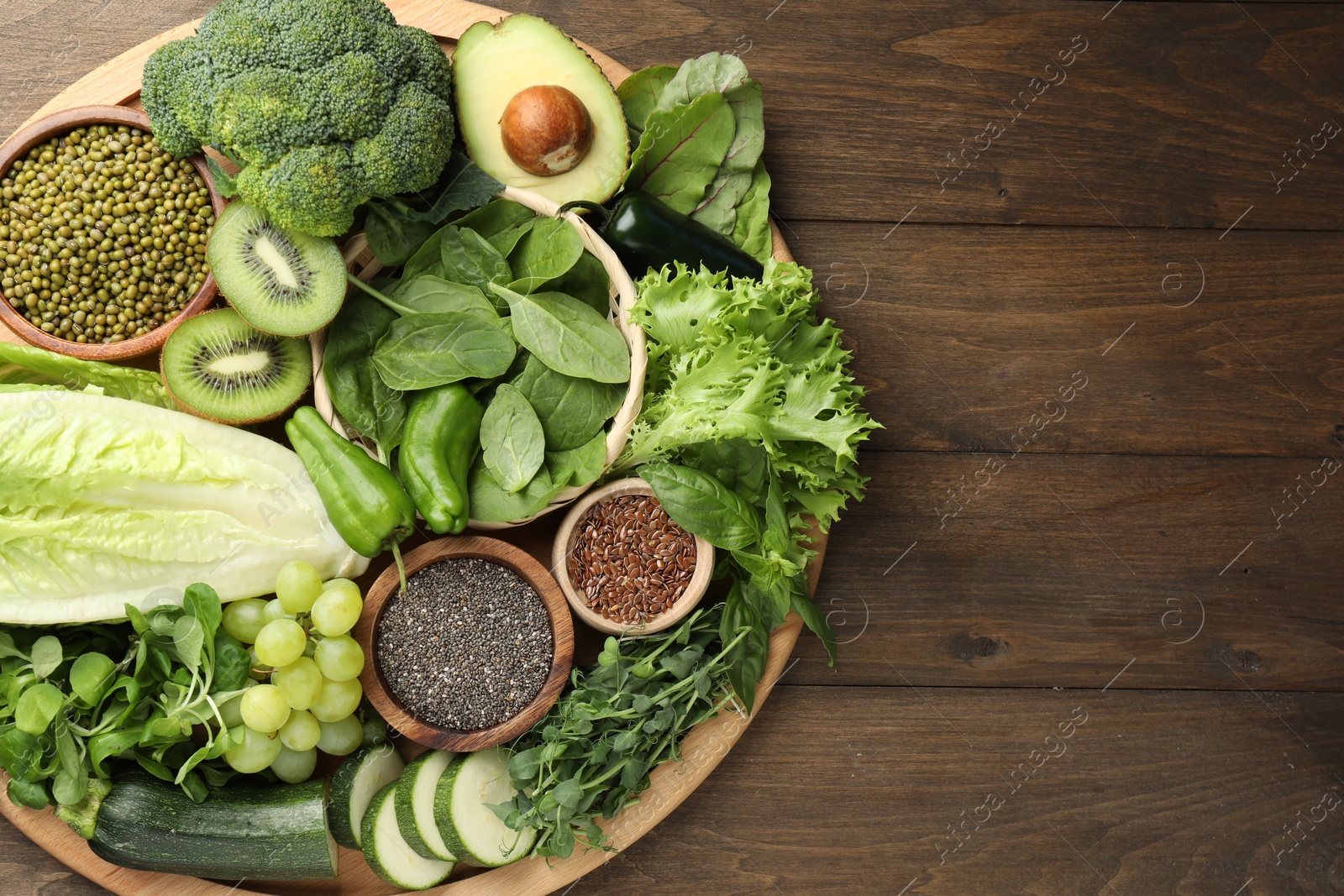 Photo of Superfood. Different healthy products on wooden table, top view. Space for text