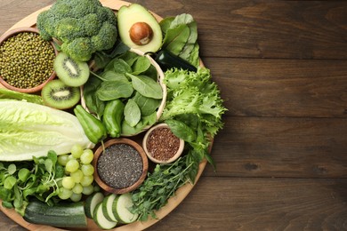 Photo of Superfood. Different healthy products on wooden table, top view. Space for text