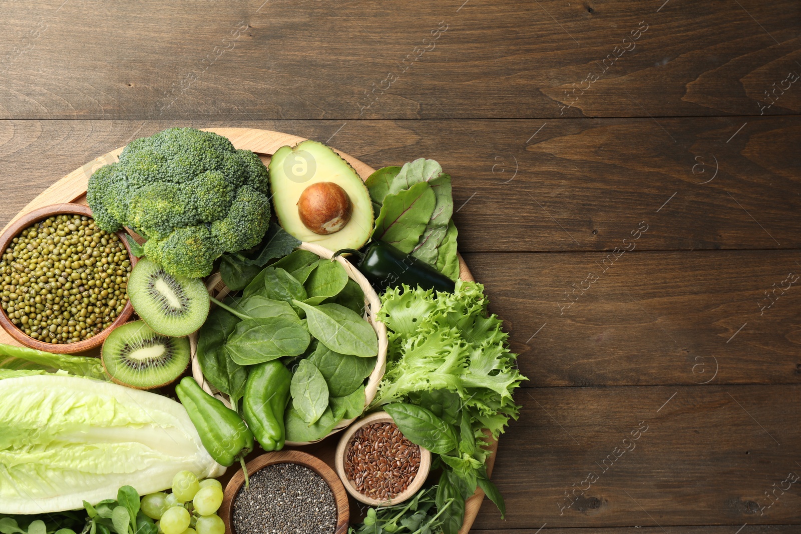 Photo of Superfood. Different healthy products on wooden table, top view. Space for text