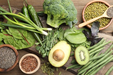 Photo of Superfood. Different healthy products on wooden table, flat lay