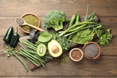 Photo of Superfood. Different healthy products on wooden table, flat lay