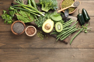 Photo of Superfood. Different healthy products on wooden table, flat lay